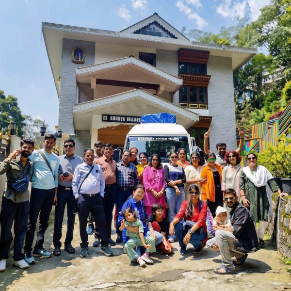 Group of happy guests in front of Kunden Fortune Resort in Gangtok, Sikkim.